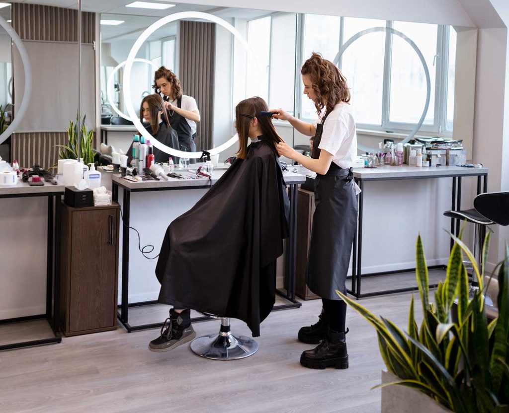 Hairdresser taking care client